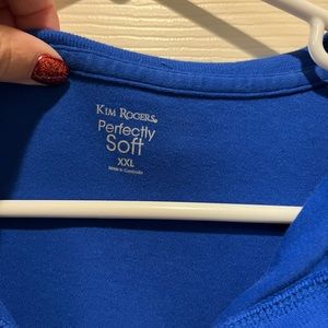 Blue short shelved colored shirt. Good for golf tournaments.